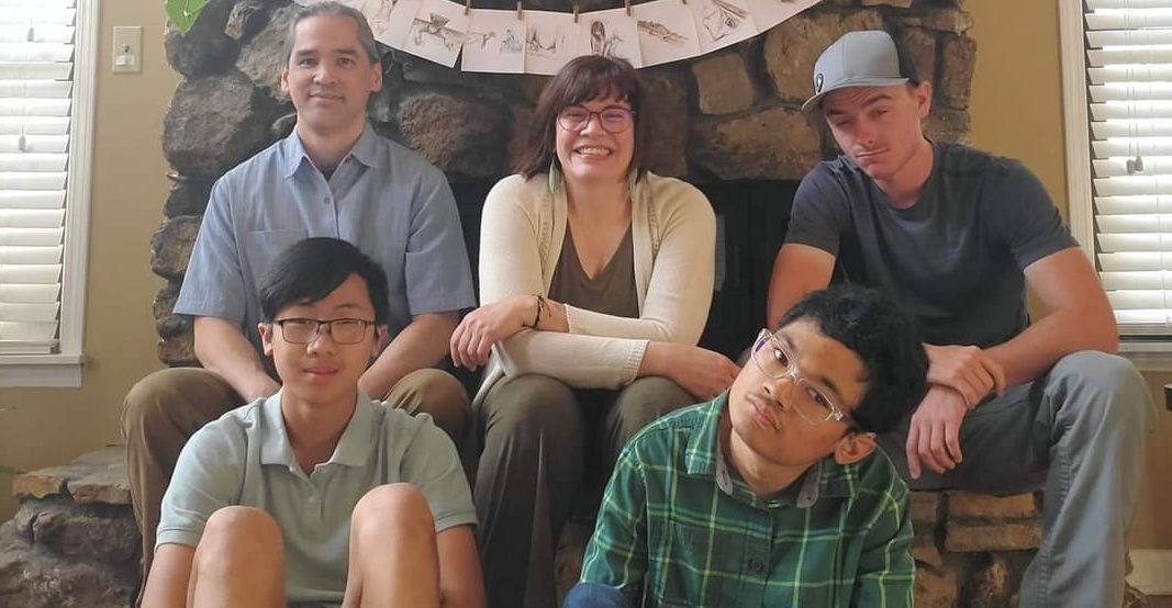 family photo of Guilaran family with their 3 sons, Lesley and her husband