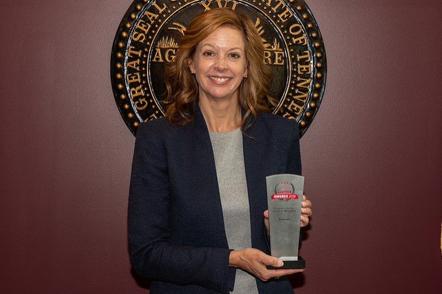 Commissioner Julie Mix McPeak with Captive Insurance Award Commissioner Julie Mix McPeak with Captive Insurance Award