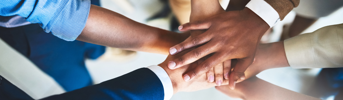 hands in a teamwork pile