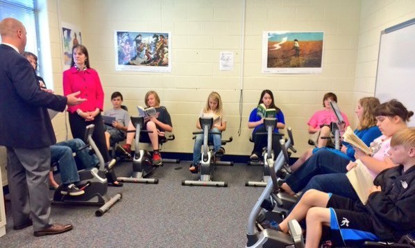 Reading Activities Students reading while on exercise bikes