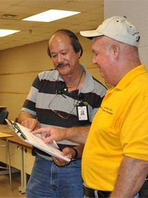 Ripley, TN, June 2, 2011 -- Information Technology Specialist Richard Cruz discusses his needs for the opening of the Lauderdale County Disaster Recovery Center with County Emergency Manager, Jim Jarrett. FEMA Logistics teams work closely with local authorities when setting up a DRC. Marilee Caliendo/FEMA Ripley, TN, June 2, 2011 -- Information Technology Specialist Richard Cruz discusses his needs for the opening of the Lauderdale County Disaster Recovery Center with County Emergency Manager, Jim Jarrett. FEMA Logistics teams work closely with local authorities when setting up a DRC. Marilee Caliendo/FEMA