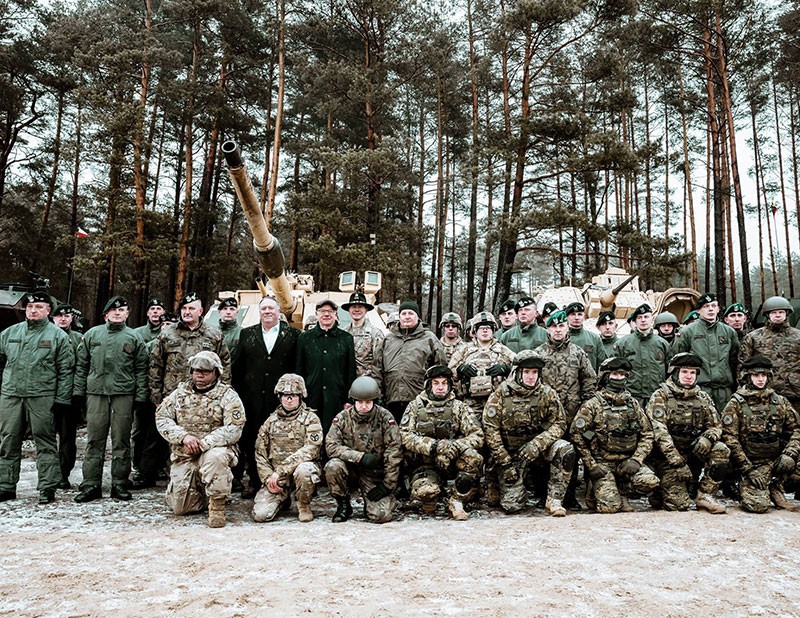U.S. Secretary of State Michael R. Pompeo poses with Allied troops from NATO’s Enhanced Forward Presence Forces, which include soldiers of the 278th Armored Cavalry Regiment, at the Bemowo Piskie Training Area in Poland on February 13, 2019. U.S. Secretary of State Michael R. Pompeo poses with Allied troops from NATO’s Enhanced Forward Presence Forces, which include soldiers of the 278th Armored Cavalry Regiment, at the Bemowo Piskie Training Area in Poland on February 13, 2019.