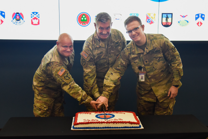 Master Sgt. Mike Avella, Maj. Gen. Jeff Holmes, and Spc. Caleb Cooper use a ceremonial saber to cut a cake celebrating the National Guard’s 386th birthday at Nashville’s Joint Force Headquarters, Dec. 13. (Photo by retired Sgt. 1st Class William Jones) Master Sgt. Mike Avella, Maj. Gen. Jeff Holmes, and Spc. Caleb Cooper use a ceremonial saber to cut a cake celebrating the National Guard’s 386th birthday at Nashville’s Joint Force Headquarters, Dec. 13. (Photo by retired Sgt. 1st Class William Jones)